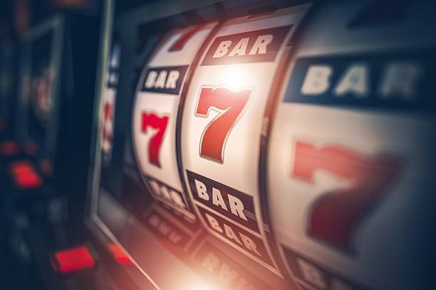 Mobile phone displaying live football and slots dashboard